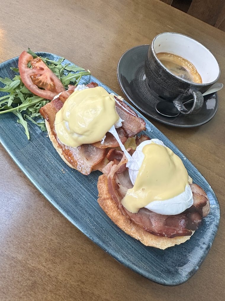Eggs Benedict with bacon, poached eggs and hollandaise.